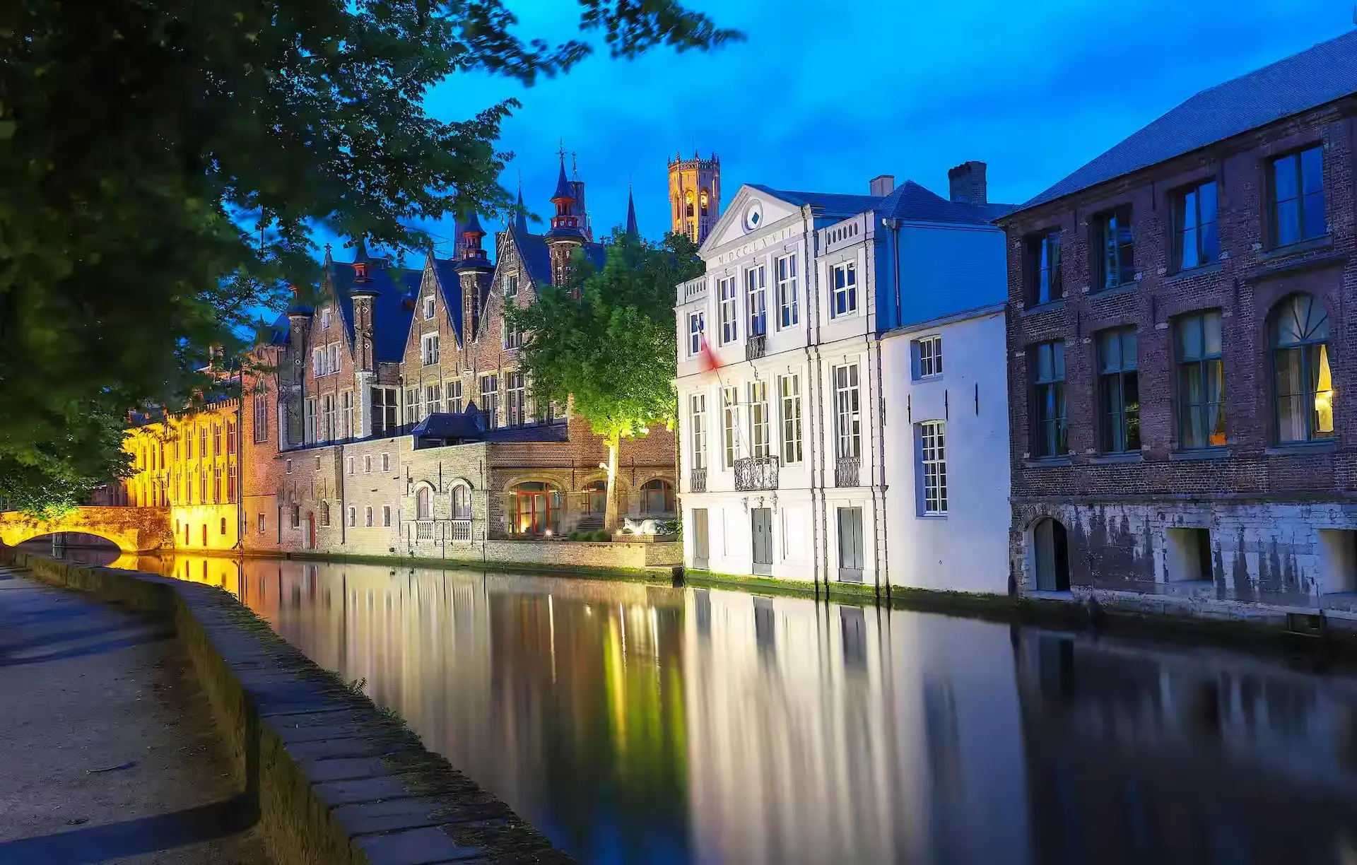 Scenic city view of bruges canal with beautiful medieval colored houses
